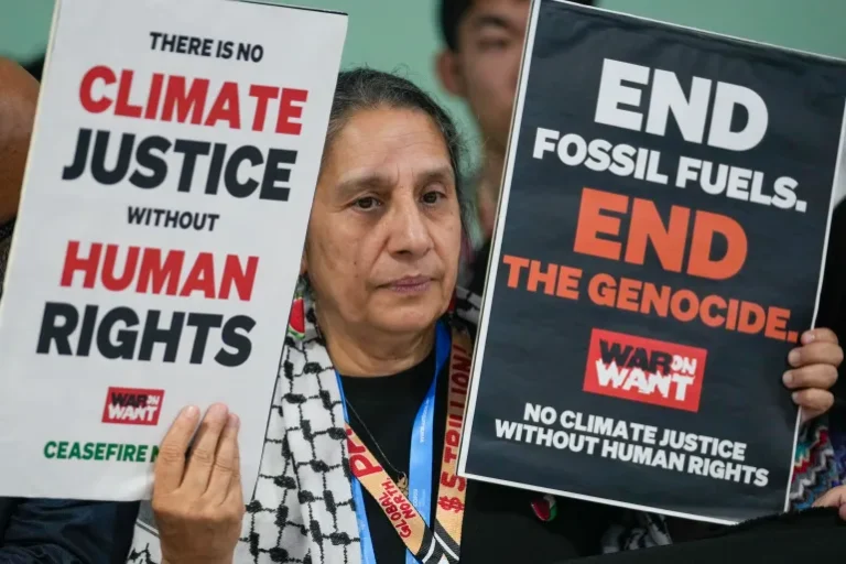 An activist demonstrates for climate justice and a ceasefire in Gaza at the UN Climate Summit on November 11, 2024 in Baku [Rafiq Maqbool/AP Photo]